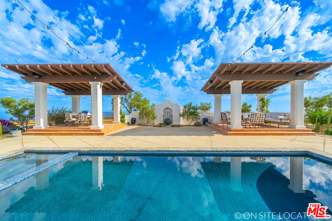 9785 Deer Creek Road Malibu, CA 90265 - Photo 45 of 75 a view of a backyard with swimming pool