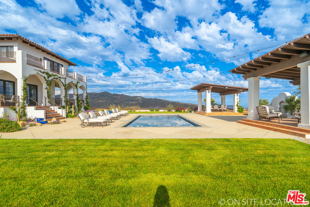 9785 Deer Creek Road Malibu, CA 90265 - Photo 55 of 75 a view of swimming pool with outdoor seating
