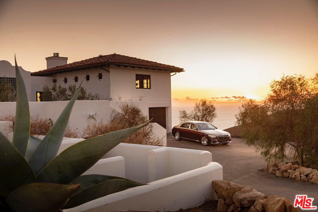 9785 Deer Creek Road Malibu, CA 90265 - Photo 70 of 75 a view of a car parked in front of a house
