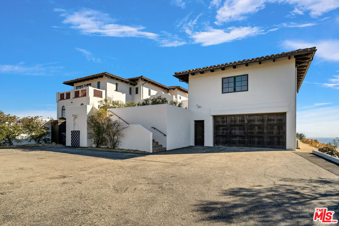 9785 Deer Creek Road Malibu, CA 90265 - Photo 7 of 75 a view of a house with a yard