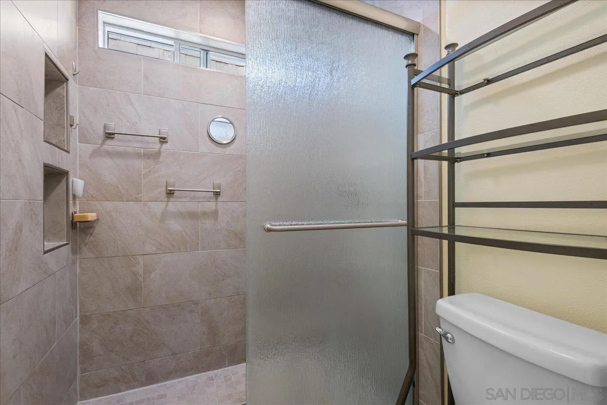 10738 2nd Street Santee, CA 92071 - Photo 27 of 52 a bathroom with a shower and toilet