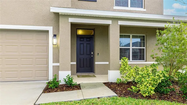 a work room with furniture and a potted plant