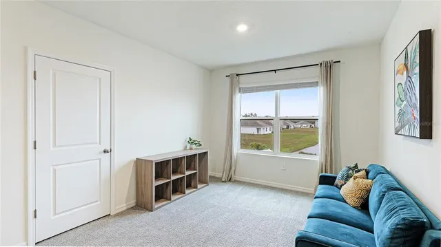 a bedroom with a bed and a sink