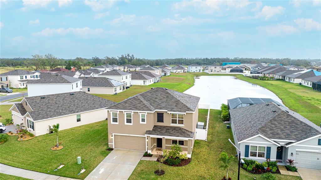 2118 Grand Flora Trail Bradenton, FL 34208 - Photo 4 of 67 an aerial view of a house with a garden