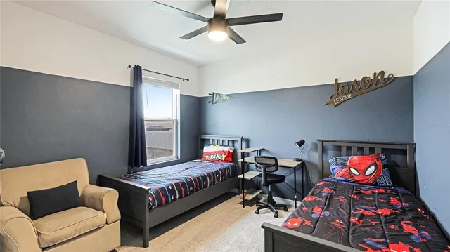 a view of a swimming pool with a lounge chair and a fire pit