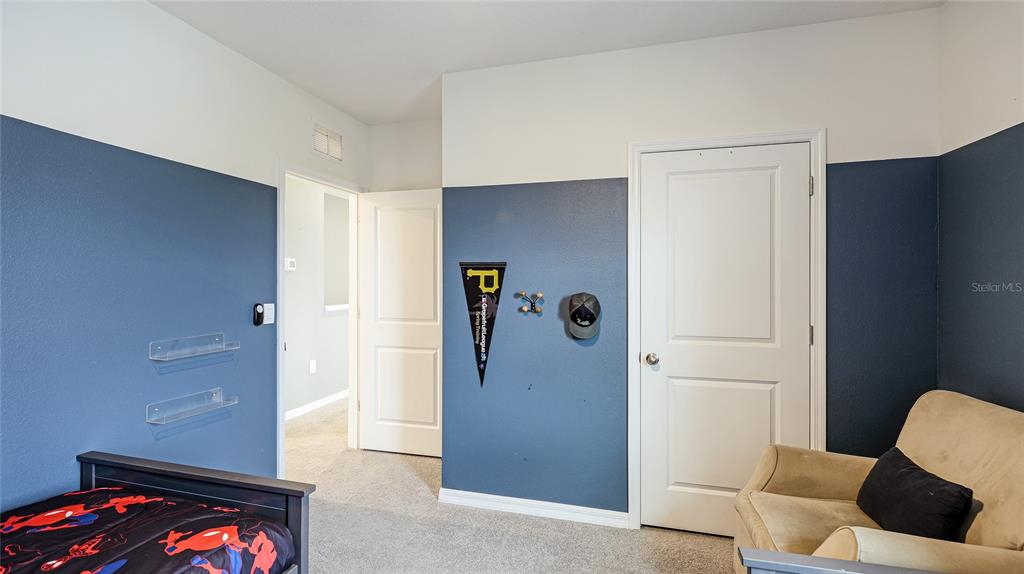 2118 Grand Flora Trail Bradenton, FL 34208 - Photo 48 of 67 a view of room with furniture and wooden floor