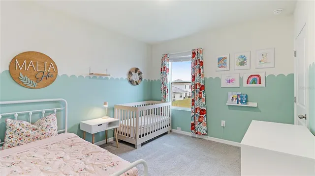 a view of small pool with a table and chairs under an umbrella