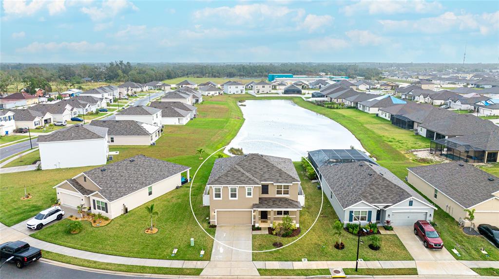 2118 Grand Flora Trail Bradenton, FL 34208 - Photo 5 of 67 an aerial view of residential houses with outdoor space and swimming pool