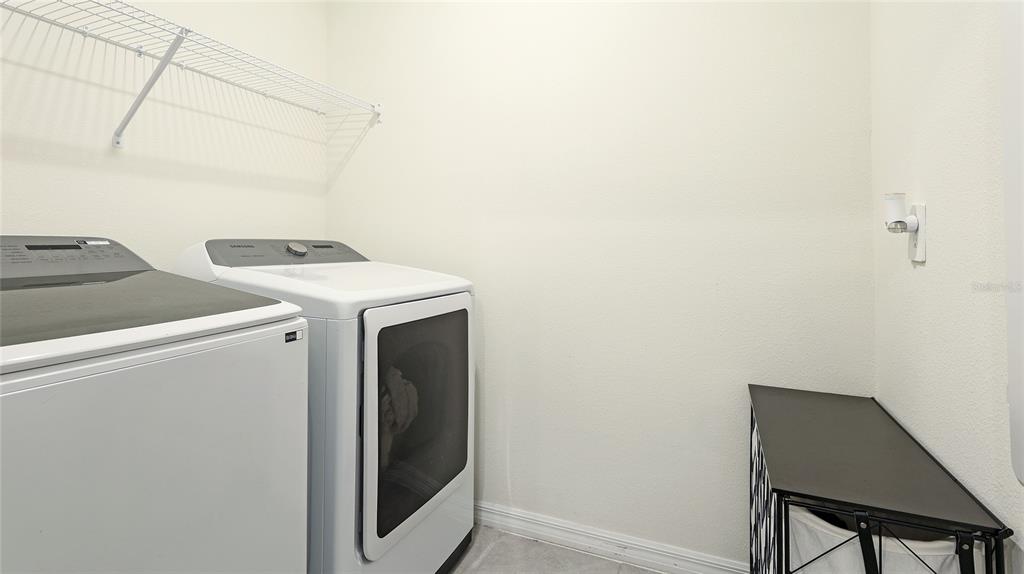 2118 Grand Flora Trail Bradenton, FL 34208 - Photo 52 of 67 a utility room with dryer and washer
