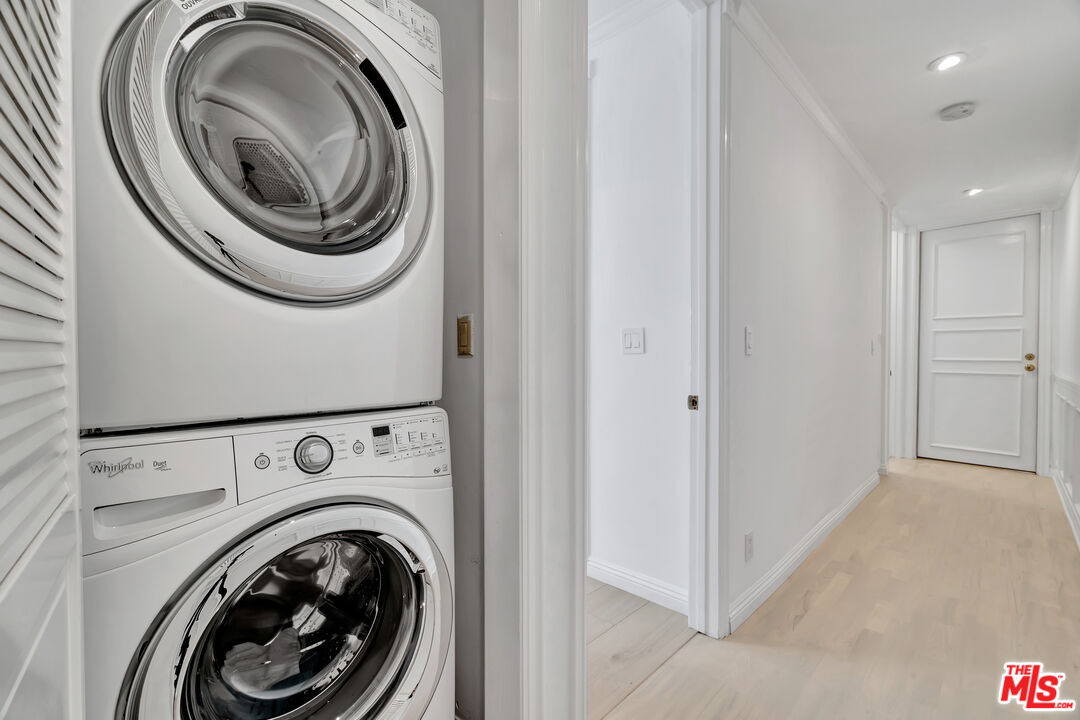 10531 Ashton Avenue, Unit 201 Los Angeles, CA 90024 - Photo 18 of 27 a view of a hallway with washer and dryer