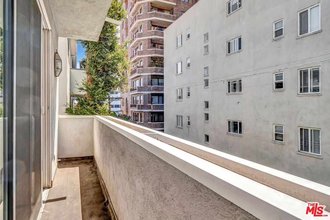 10531 Ashton Avenue, Unit 201 Los Angeles, CA 90024 - Photo 24 of 27 a view of balcony with a potted plant