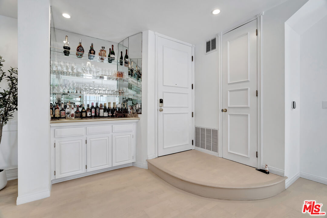 10531 Ashton Avenue, Unit 201 Los Angeles, CA 90024 - Photo 5 of 27 a view of kitchen with white cabinets