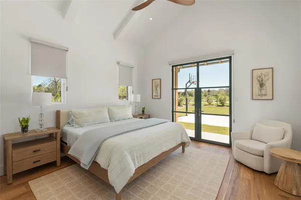 a bathroom with a granite countertop sink a mirror and a shower