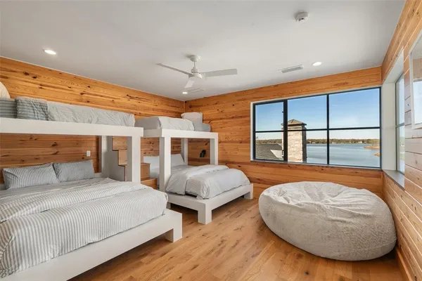 a living room with furniture a flat screen tv and a table
