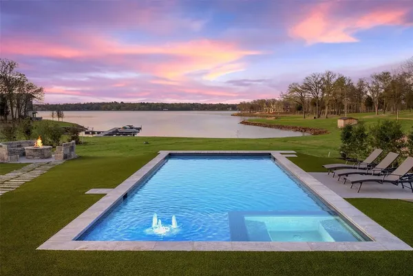 a view of swimming pool with a yard
