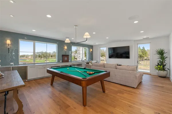 a living room with furniture and a kitchen view