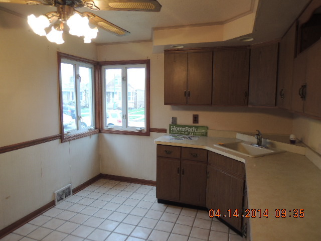 4742 South Kilpatrick Avenue Chicago, IL 60632 - Photo 12 of 21 a room with a sink window and cabinets