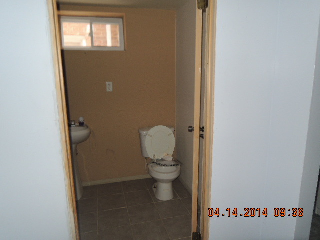 4742 South Kilpatrick Avenue Chicago, IL 60632 - Photo 18 of 21 a bathroom with a toilet