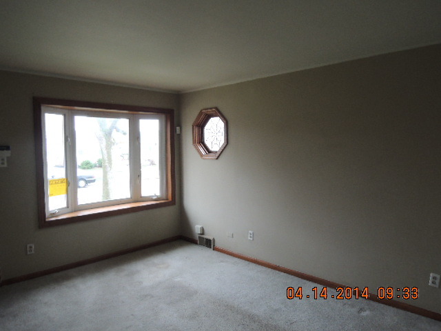 4742 South Kilpatrick Avenue Chicago, IL 60632 - Photo 3 of 21 an empty room with a window