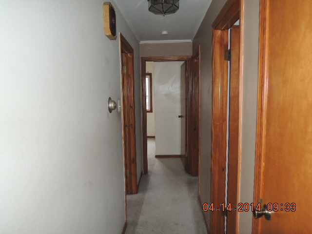 4742 South Kilpatrick Avenue Chicago, IL 60632 - Photo 4 of 21 a view of a hallway with wooden floor