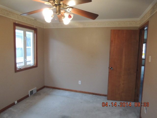 4742 South Kilpatrick Avenue Chicago, IL 60632 - Photo 8 of 21 an empty room with windows and fan