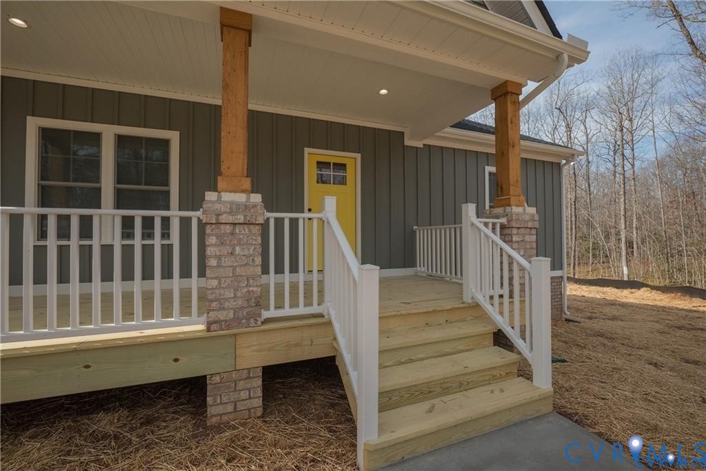 2223 Ridge Road Arvonia, VA 23004 - Photo 4 of 32 Front porch entry featuring board and batten sidin