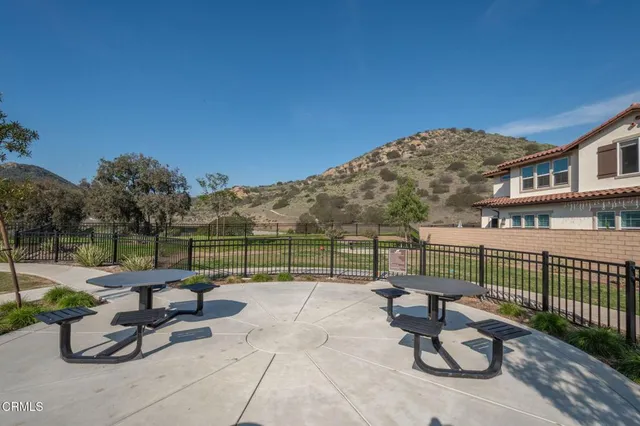 a view of a patio with a chairs and table in the patio