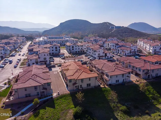 an aerial view of residential houses and outdoor space