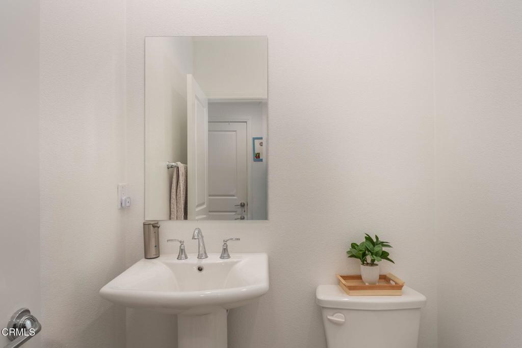231 Inspiration Camarillo, CA 93010 - Photo 7 of 47 a bathroom with a sink a toilet and a mirror