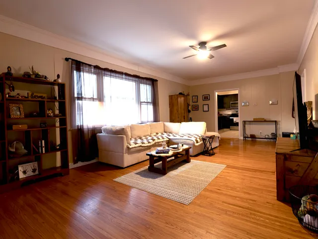 a bed room with furniture and a book shelf