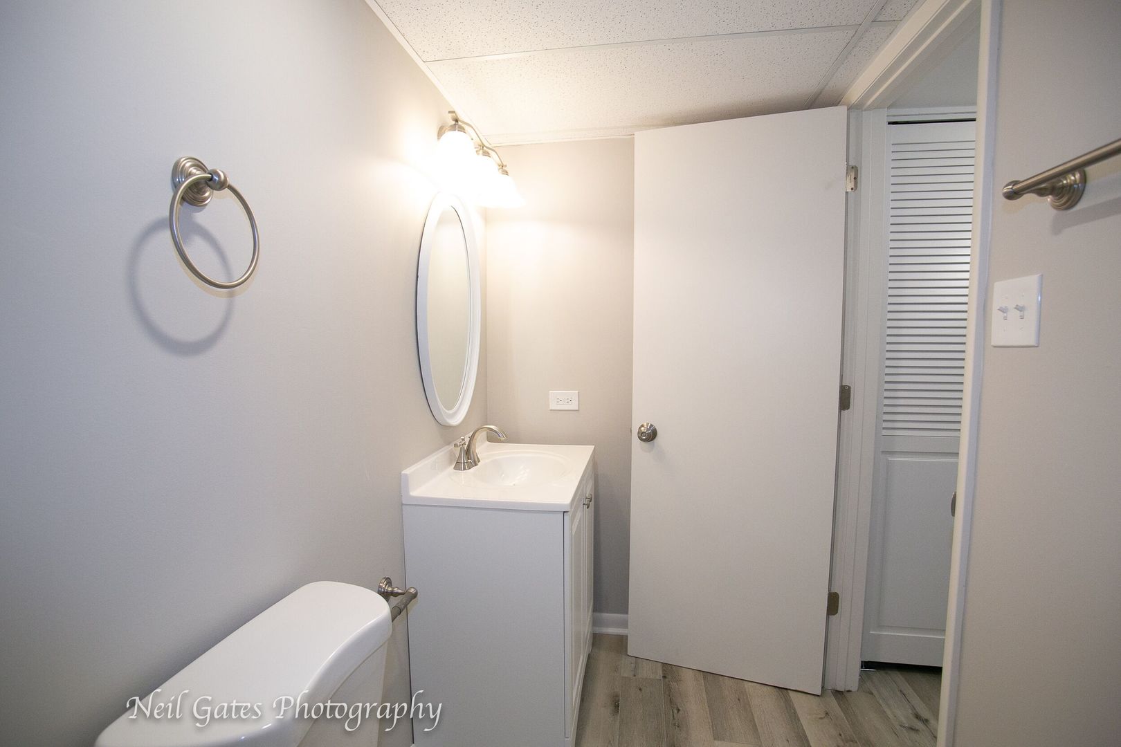 1300 South Riegel Farm Road University Park, IL 60484 - Photo 22 of 27 a bathroom with a toilet sink vanity and mirror
