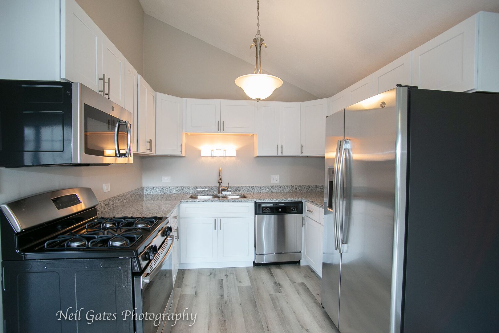 1300 South Riegel Farm Road University Park, IL 60484 - Photo 8 of 27 a kitchen with granite countertop a sink stove and refrigerator