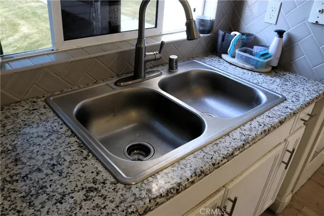 a kitchen with a stove and a sink