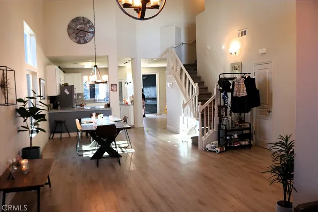 a blue couch sitting next to a blue wall with a large window