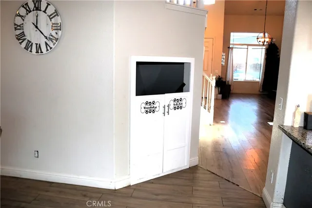 a bedroom with a bed and a mirror