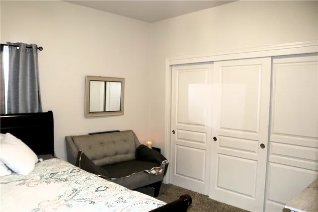 a view of a chair and fire pit in a room