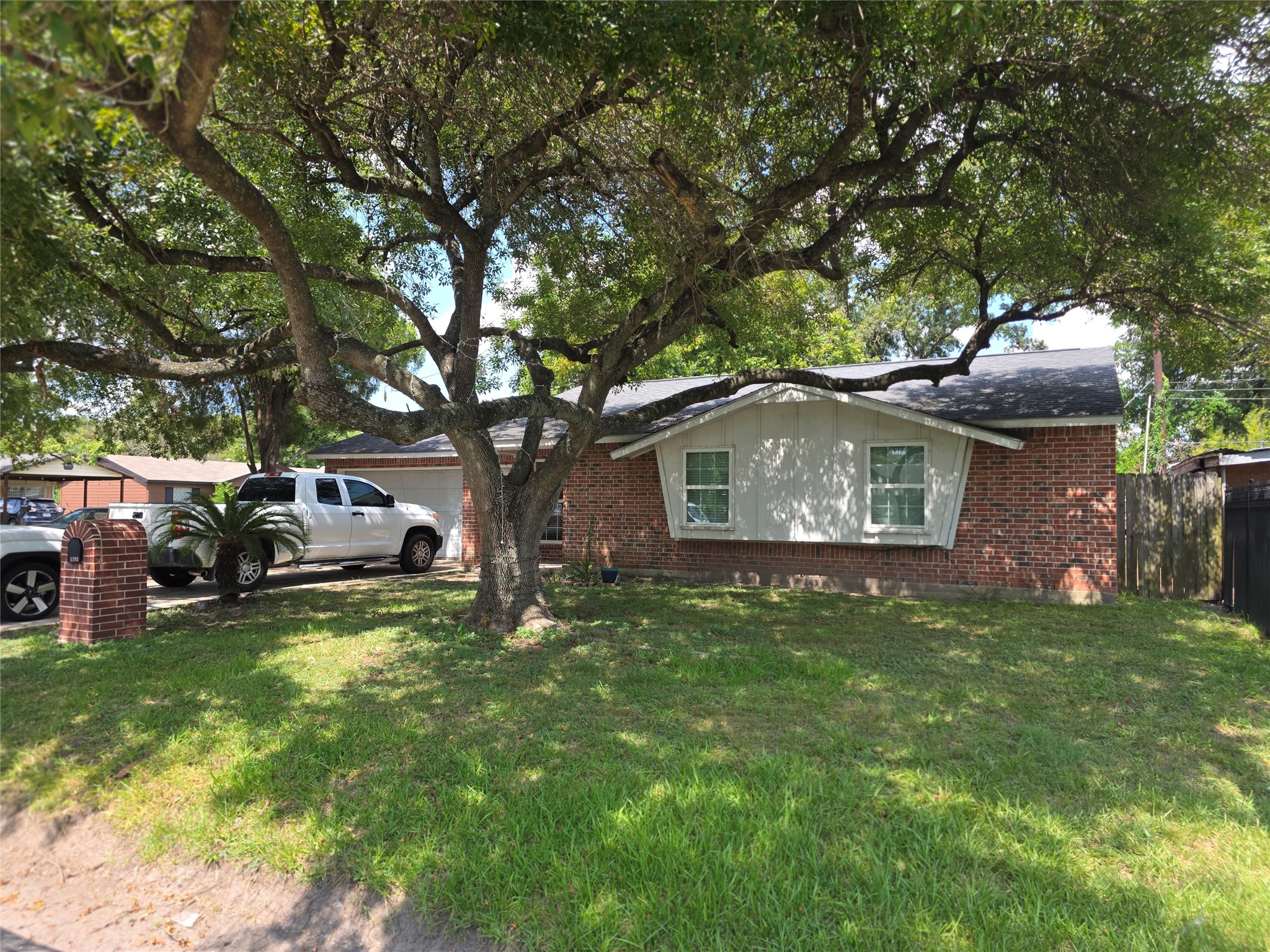1203 Mooney Road Houston, TX 77037 - Photo 2 of 17 Lots of Shade under Mature Tree in Front Yard