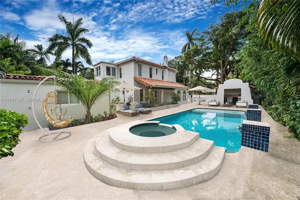 a view of a house with a yard balcony