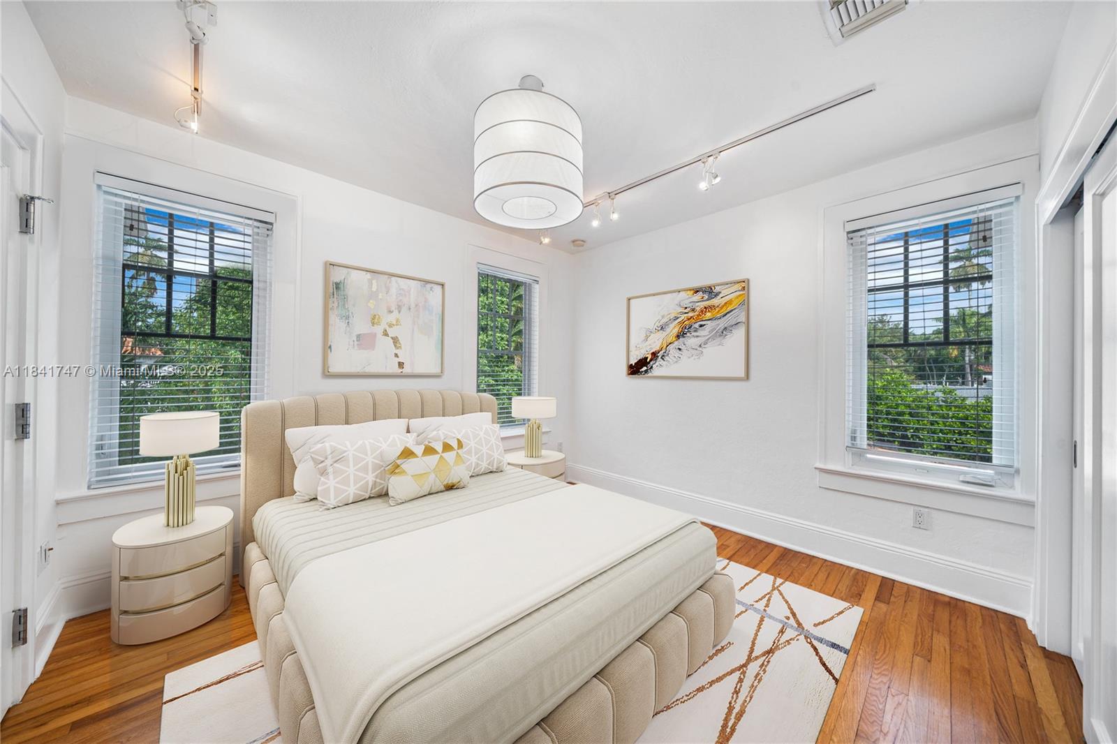 671 Northeast 57th Street Miami, FL 33137 - Photo 26 of 48 a bedroom with a bed and a large window