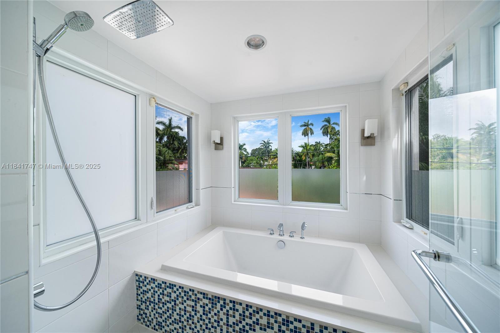 671 Northeast 57th Street Miami, FL 33137 - Photo 30 of 48 a bathroom with a tub sink and window