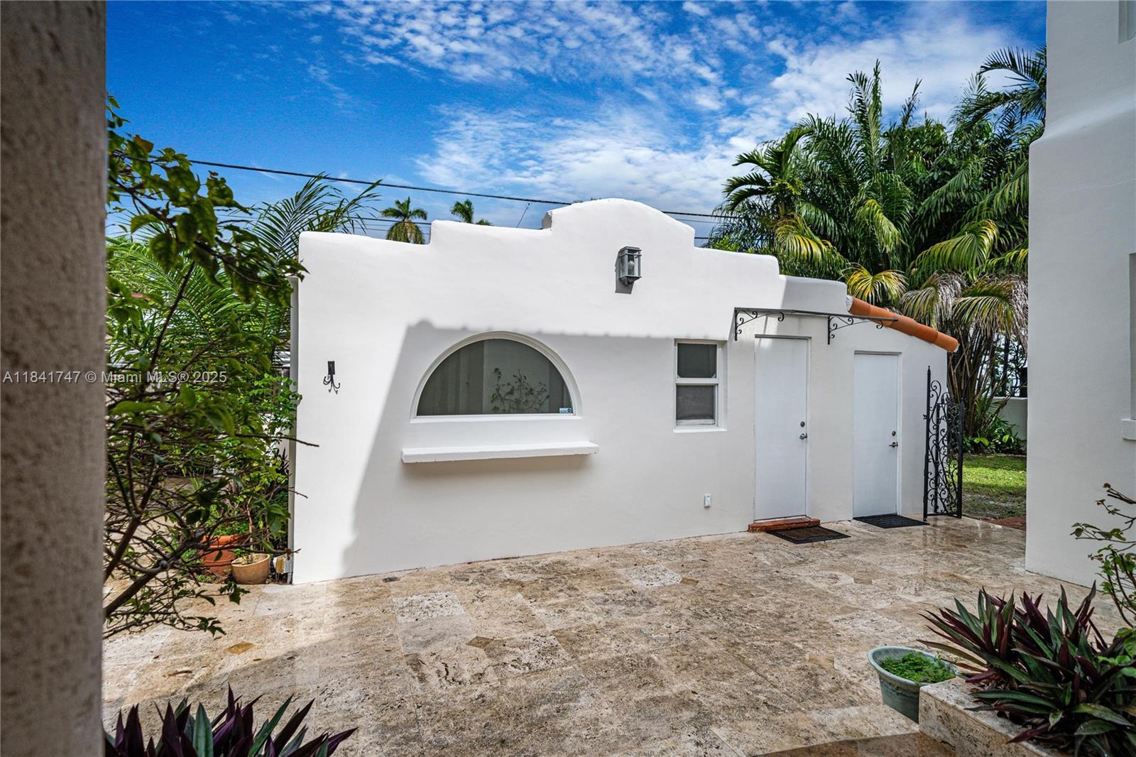 671 Northeast 57th Street Miami, FL 33137 - Photo 35 of 48 a view of a house with a tree