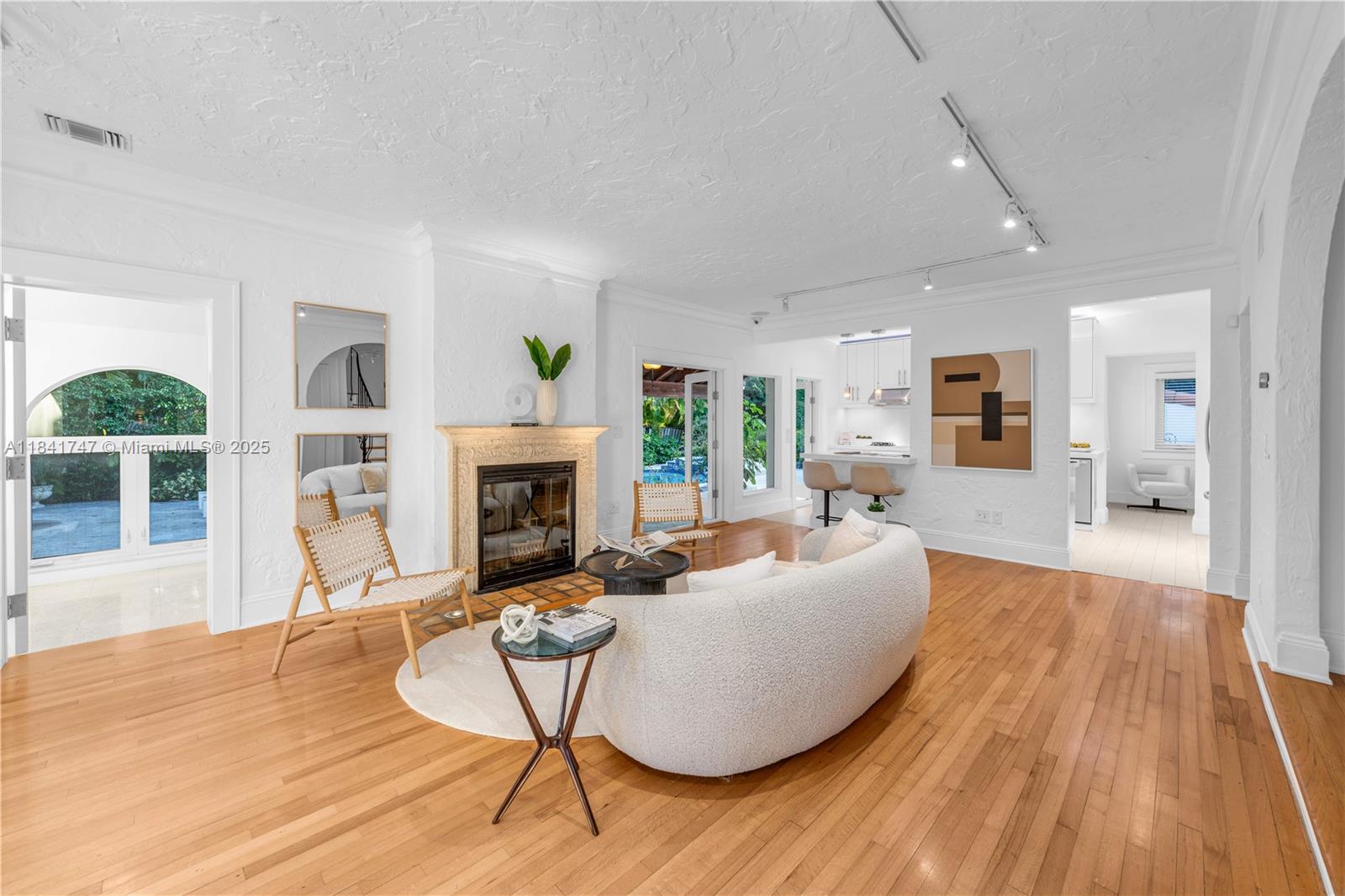 671 Northeast 57th Street Miami, FL 33137 - Photo 4 of 48 a living room with furniture and a fireplace