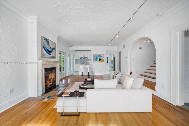a living room with furniture and a fireplace