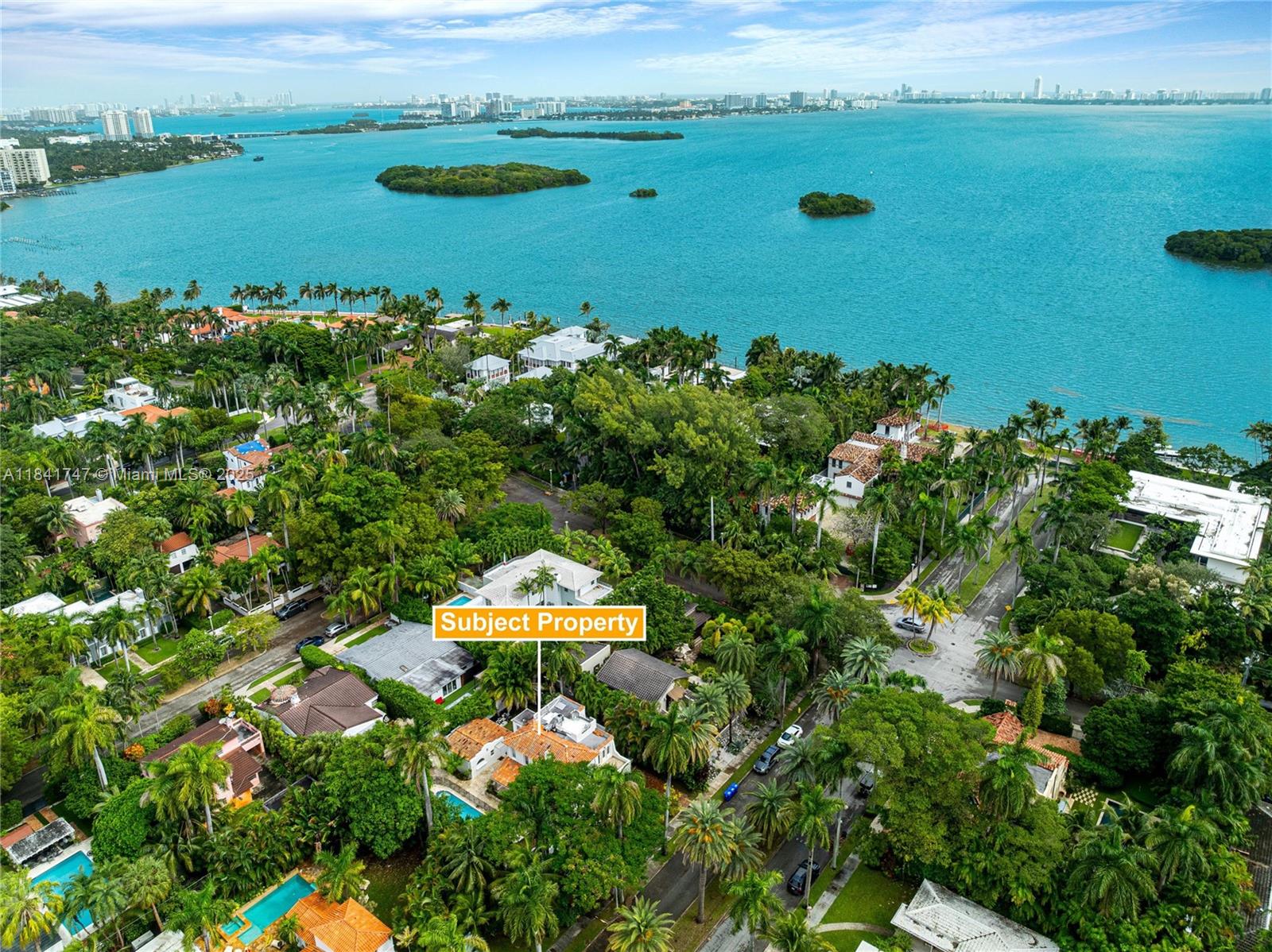 671 Northeast 57th Street Miami, FL 33137 - Photo 44 of 48 a view of a lake with a yard