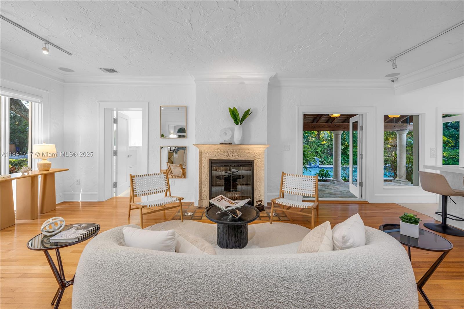 671 Northeast 57th Street Miami, FL 33137 - Photo 5 of 48 a living room with furniture and a fireplace