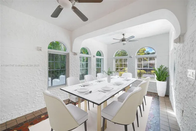 a view of a dining room with furniture wooden floor and chandelier