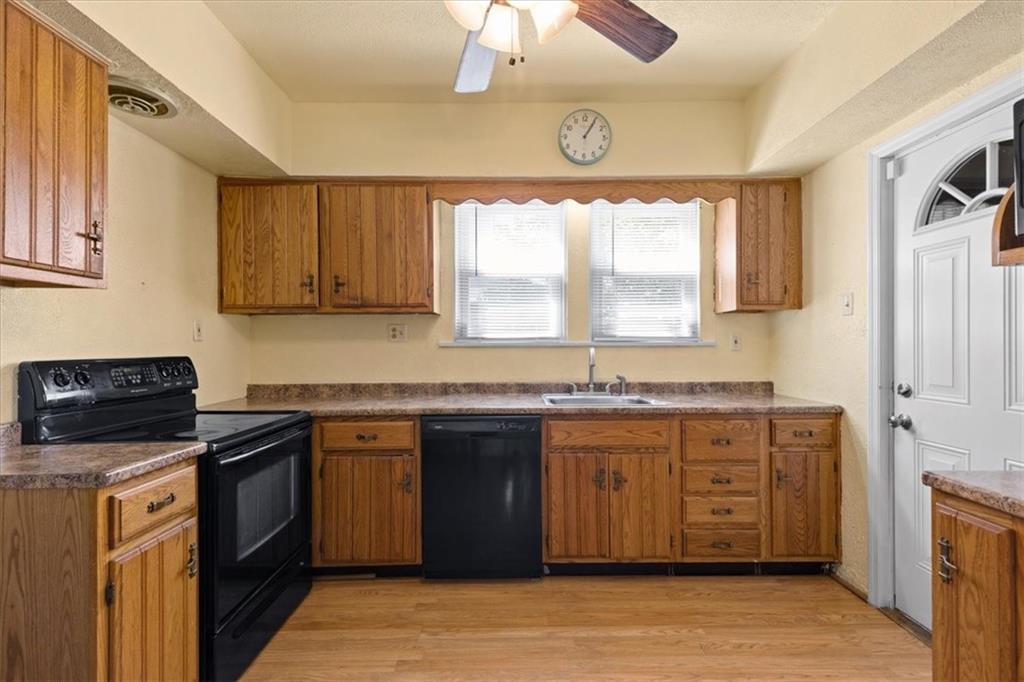 450 Irvin Avenue Rochester, PA 15074 - Photo 14 of 30 a kitchen with stainless steel appliances granite countertop a stove a sink and a microwave