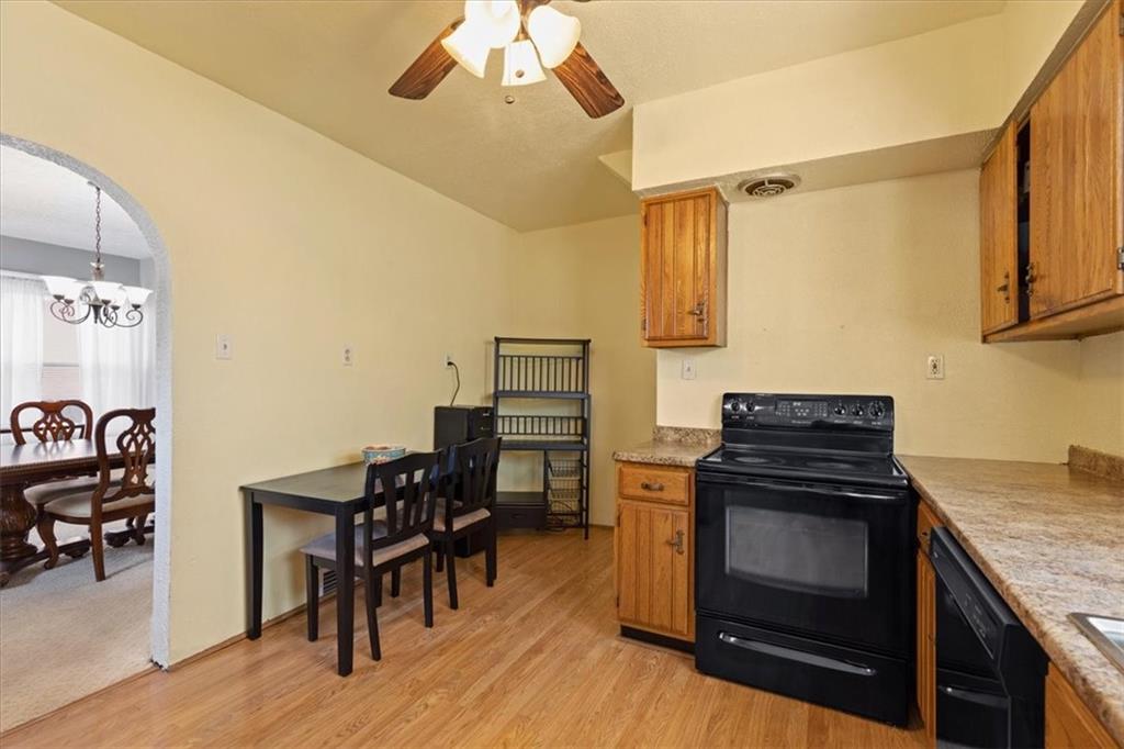 450 Irvin Avenue Rochester, PA 15074 - Photo 15 of 30 a kitchen with a stove and a wooden floor