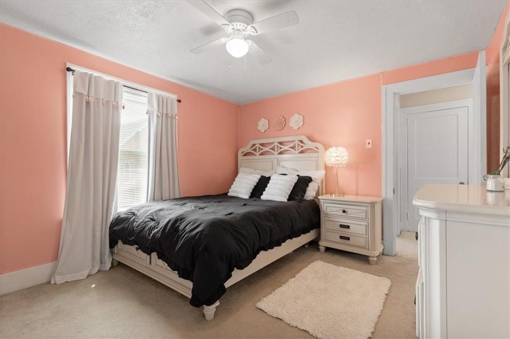 450 Irvin Avenue Rochester, PA 15074 - Photo 23 of 30 a spacious bedroom with a bed and a chandelier