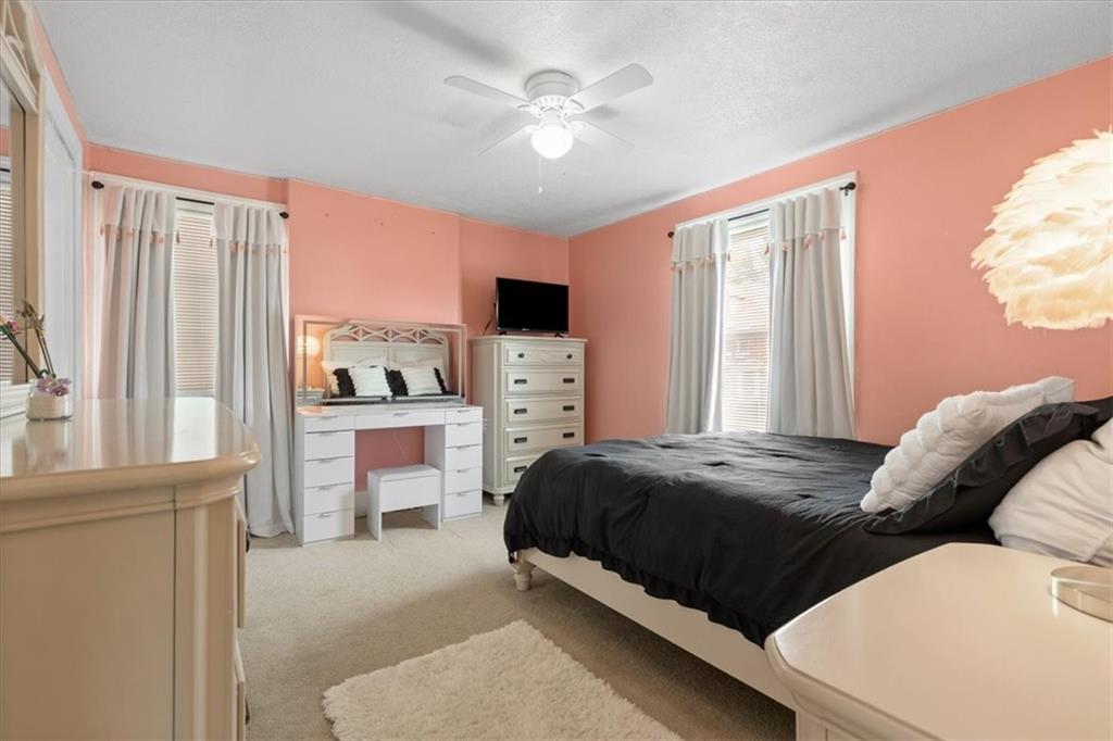450 Irvin Avenue Rochester, PA 15074 - Photo 24 of 30 a bedroom with a bed and a ceiling fan